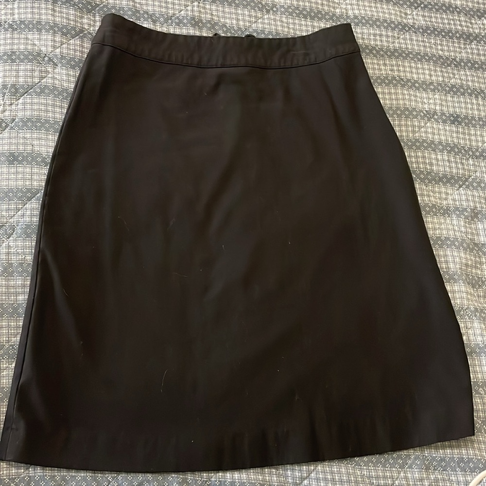 Women’s size 6, black pencil skirt stretchy. Lattice lace up. Hidden side zipper